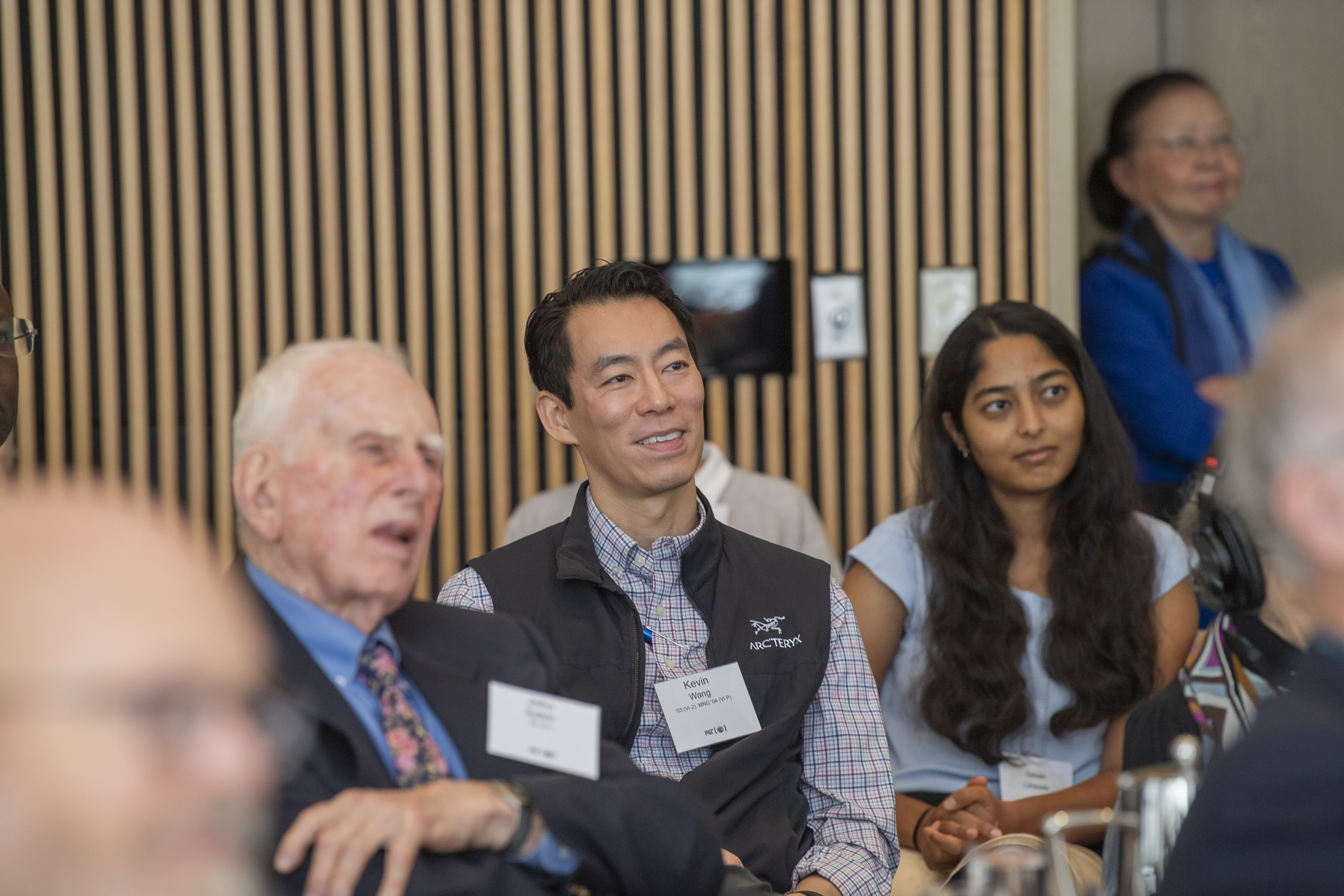 "Kevin Wang is seated in the center surrounded by guests of the KDMS Appreciation Brunch"